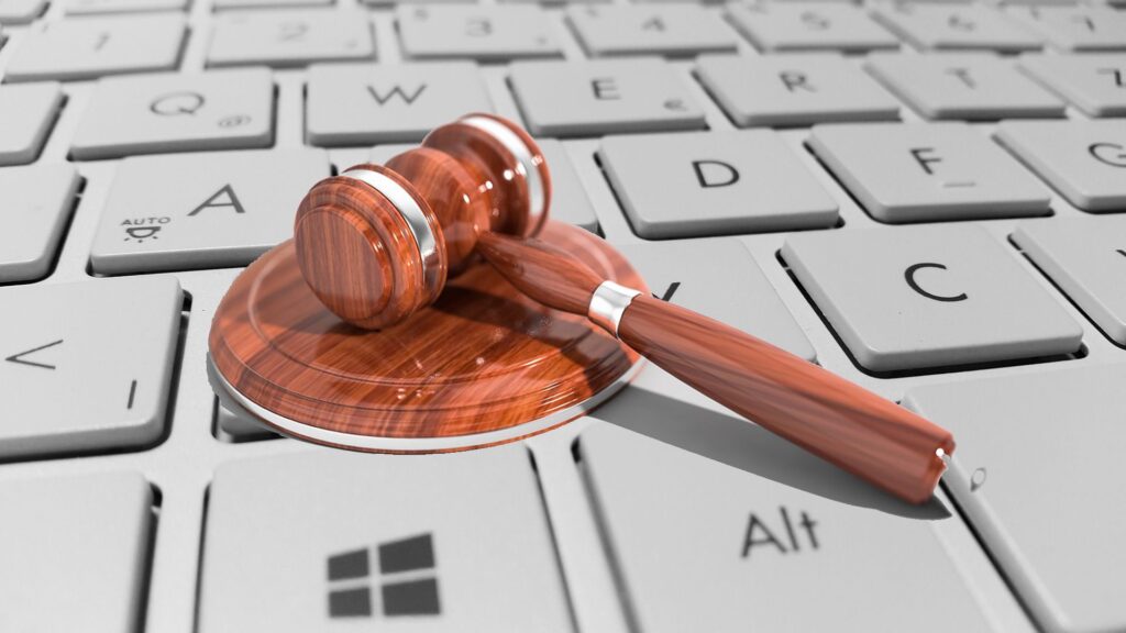 judge's gavel on a computer keyboard