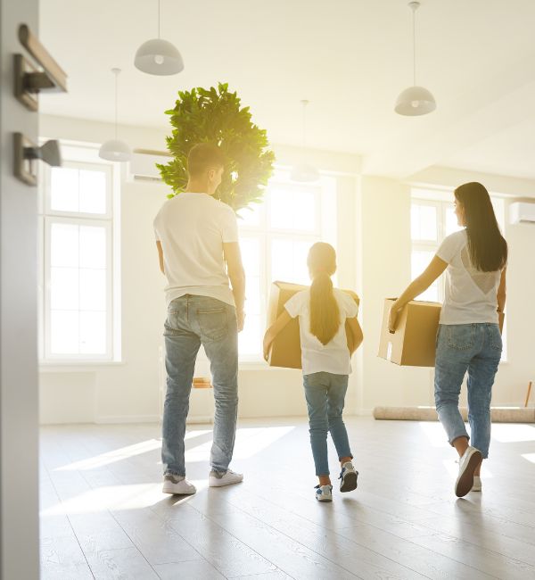 Family moving into new home after successful agreement handled by property settlement lawyers.